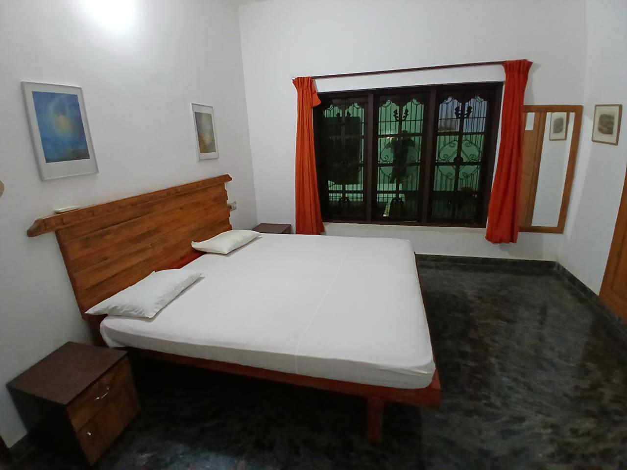 Spacious private guest room with a large window
