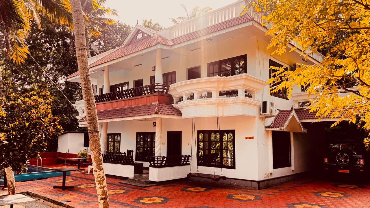 Whispering Kera homestay exterior in its tropical garden