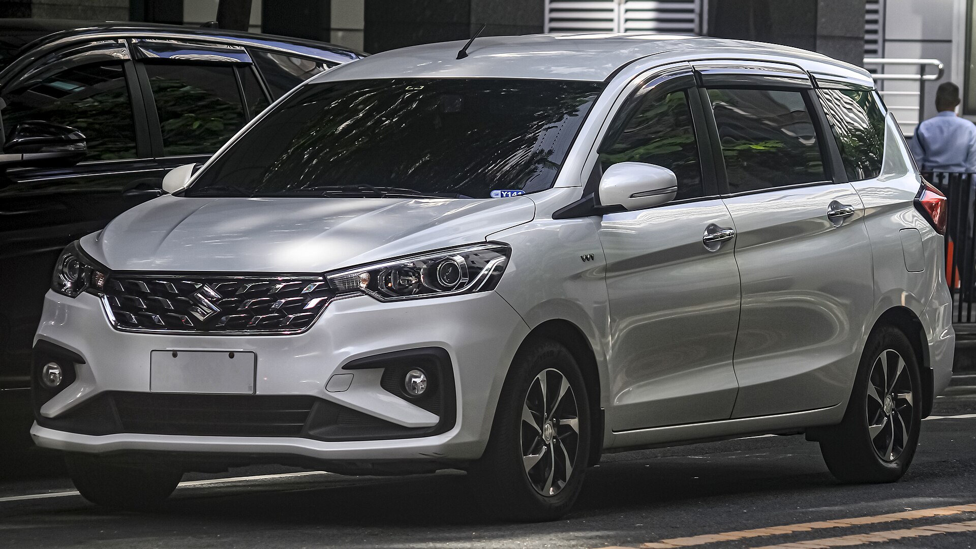 White Suzuki Ertiga representative of the seven-seater AC cab fleet